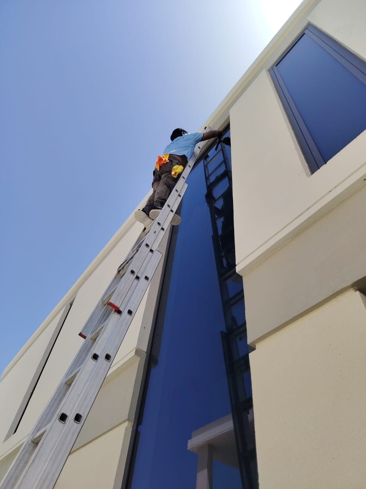 Ladder access for exterior glass